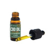 An open bottle of CBD Oil with turmeric with an oil filled pipette next to the bottle